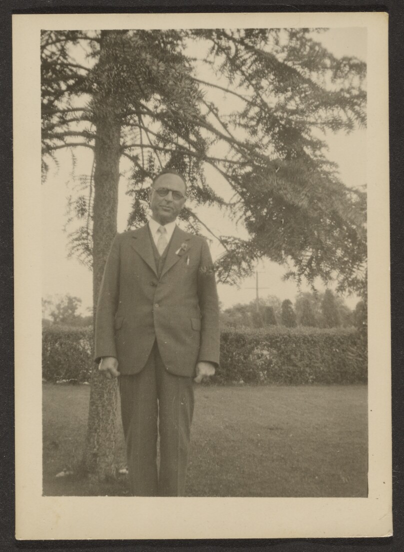 [Man Standing by Tree]