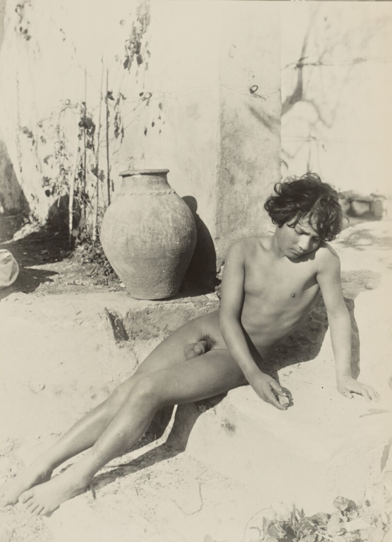 [Nude youth reclining on steps]