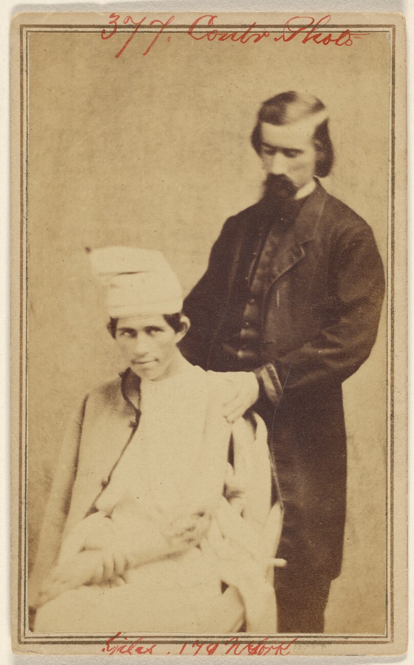 E. Giles [Doctor with Civil War victim]