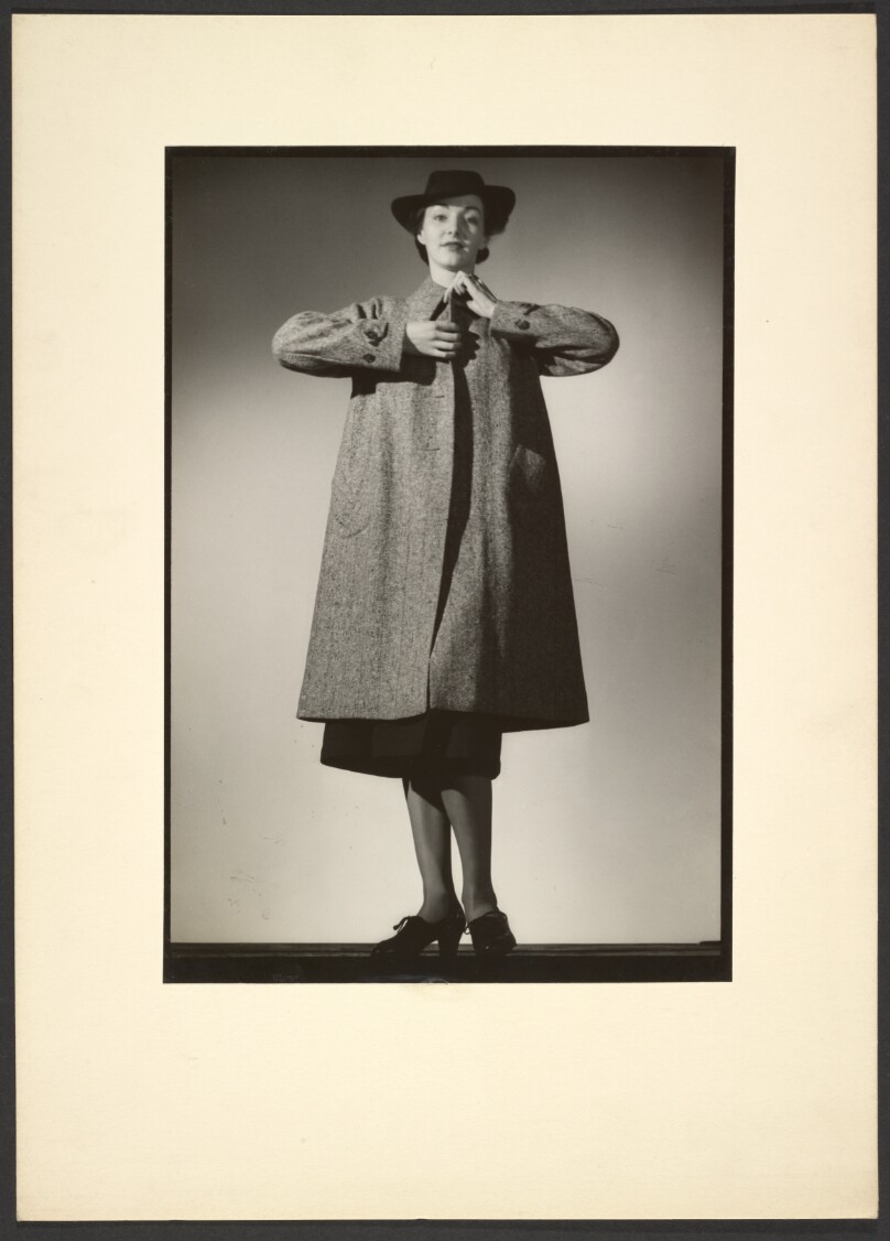[Woman modeling a coat]