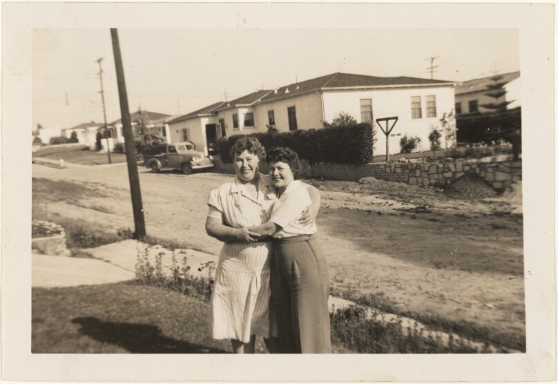 [Two women hugging]