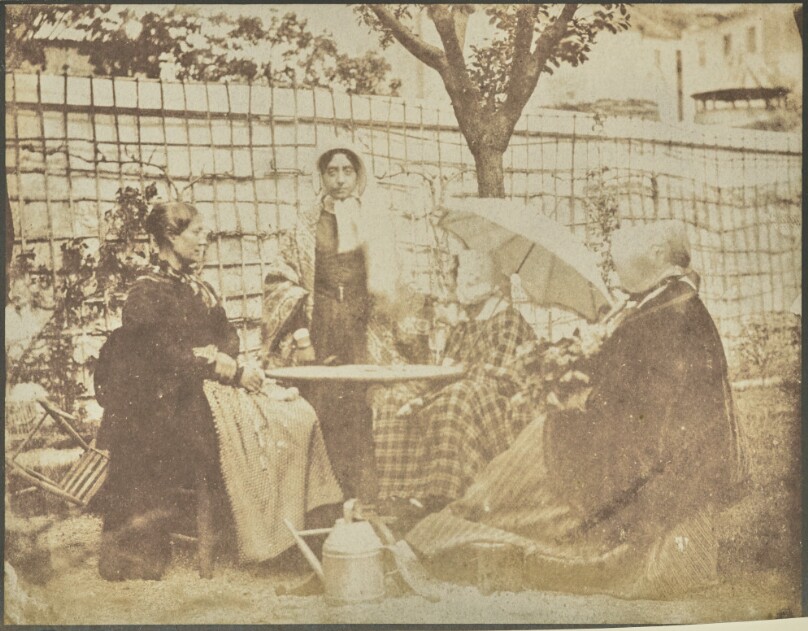 [Four Women Seated Outdoors]