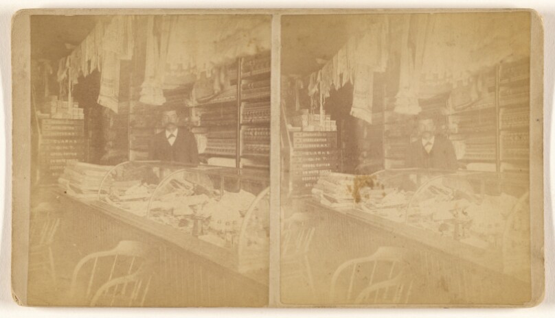 [Interior of a country store, man at front counter]