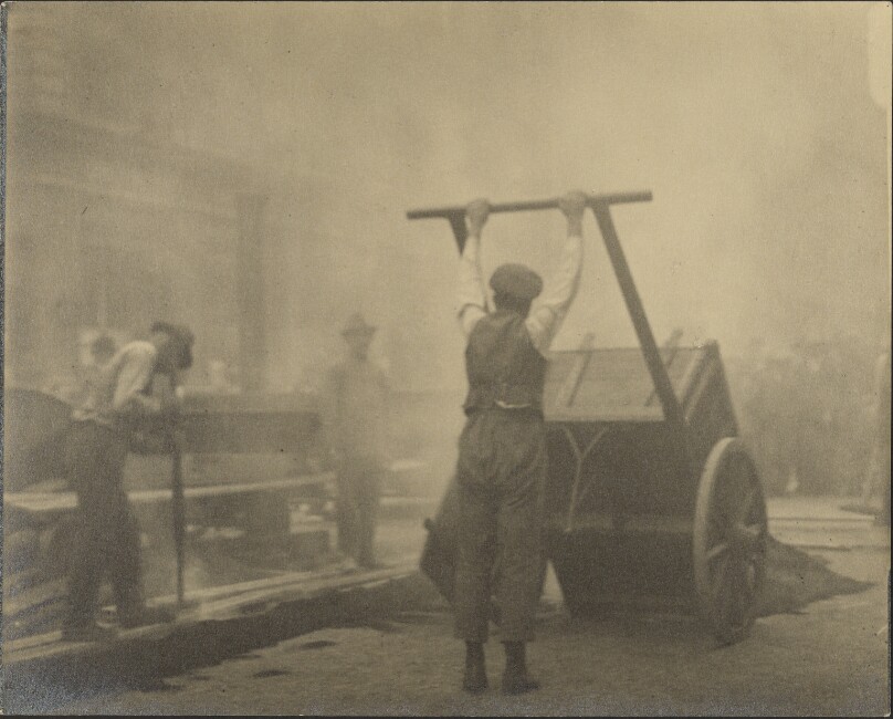[Man emptying cart]