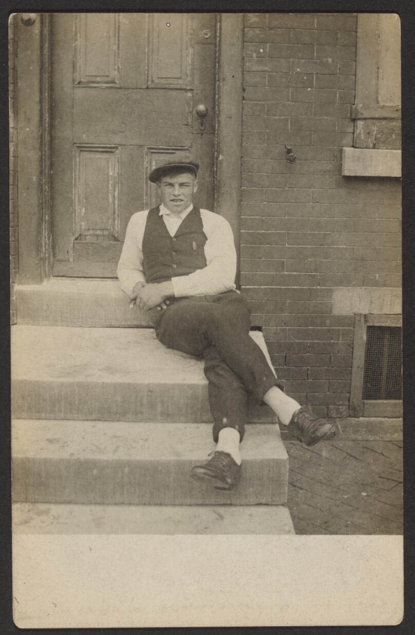 [Seated man on steps]