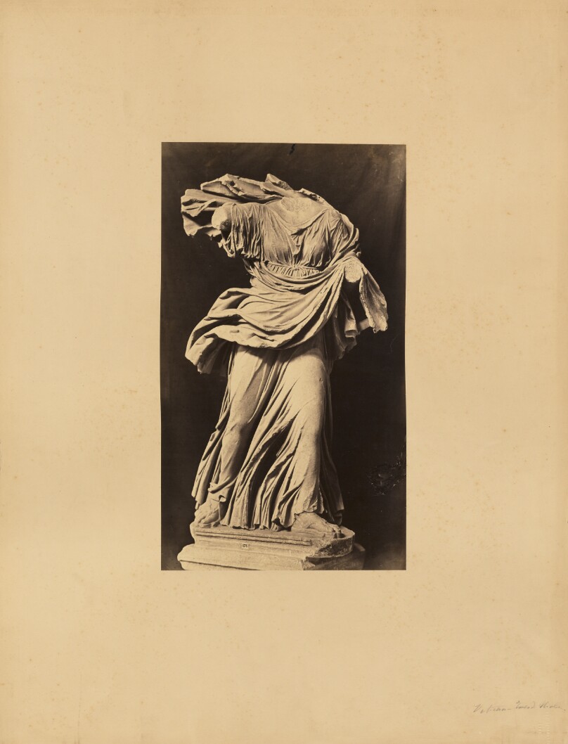 [Classical sculpture of a headless woman]