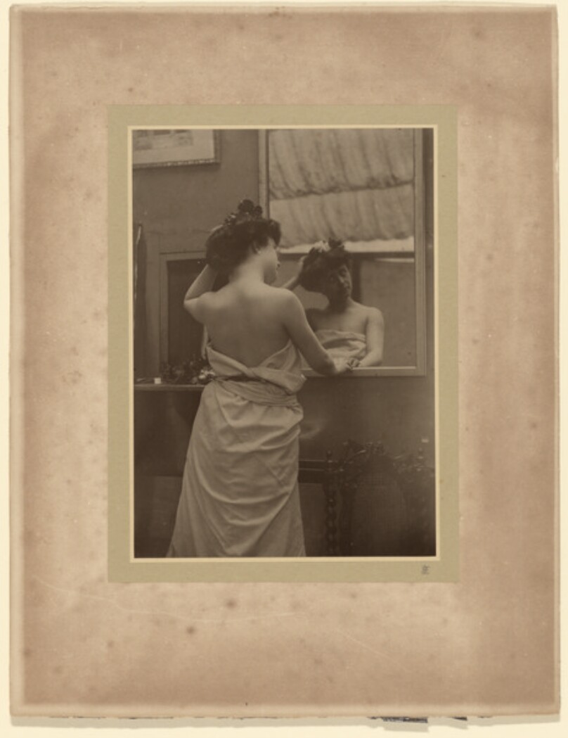 [Woman at a mirror]