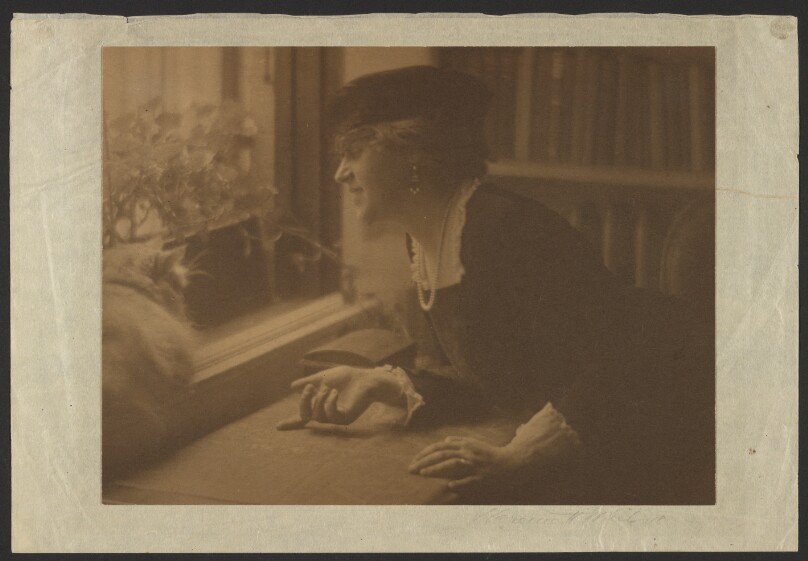 [Portrait of an Elegant Woman Posed with a Cat Near a Window]