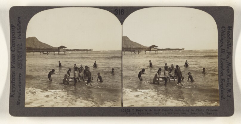 Boys with Surf Boards Indulging in Their Famous Native Sport on Beach at Waikiki, near Honolulu, Hawaii.