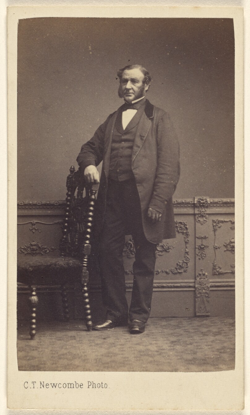 [Unidentified man with long muttonchops, standing]