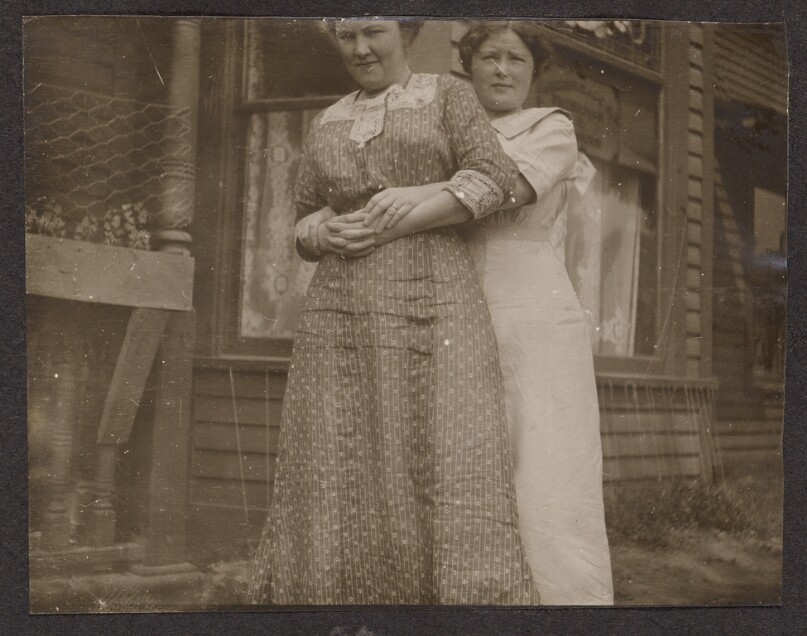 [Two women embracing]