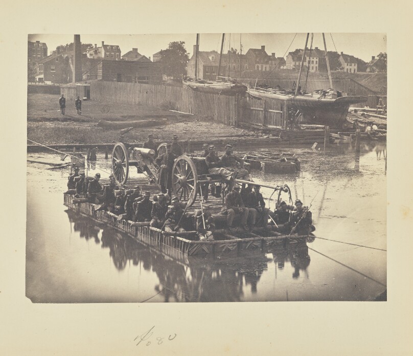[Raft of blanket boats ferrying field artillery and men over Potomac River]
