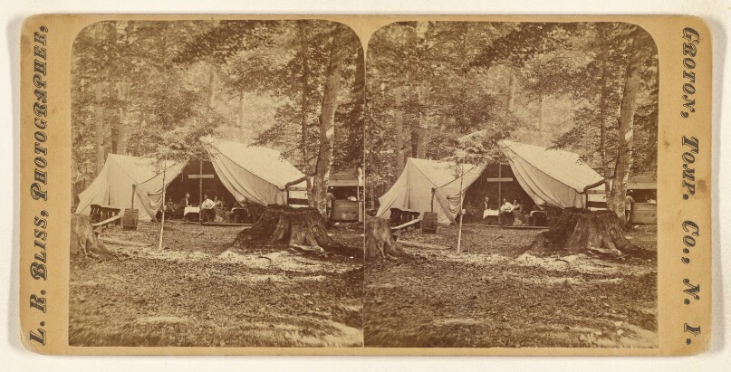 [Campsite with tents, group of people inside one of them, possibly at Groton, Ensenore Glen, New York]