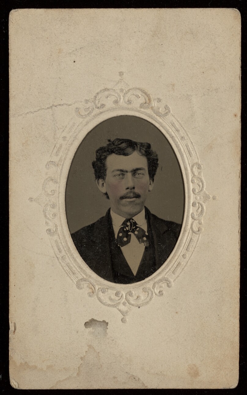 [Unidentified man with moustache, wearing a tie]