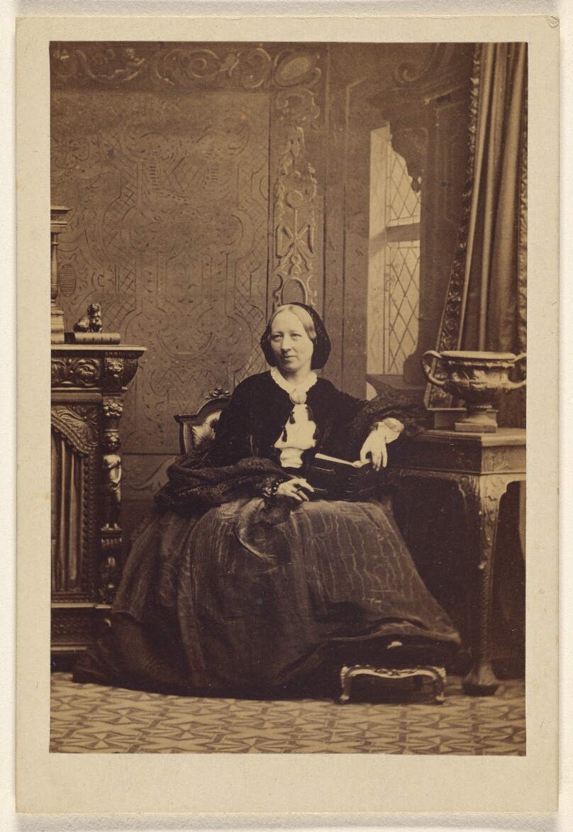 [Elderly woman, seated]