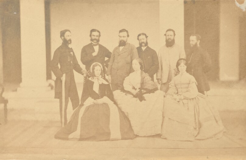 [Group portrait of six men and three women, India]