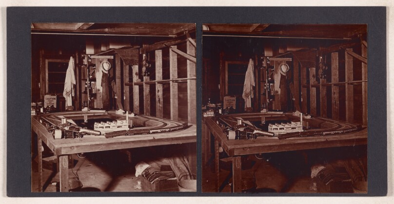 [Toy train set in garage]