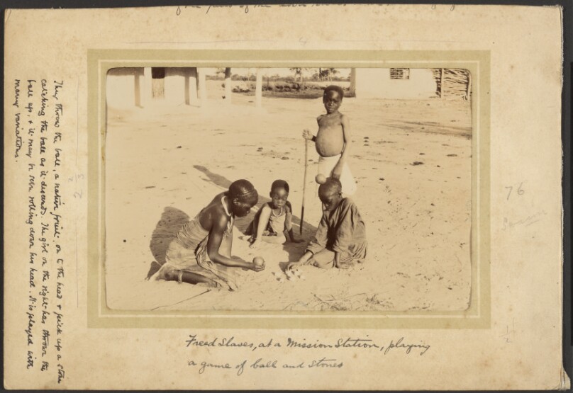 [Young Black girls playing is a sandy area]