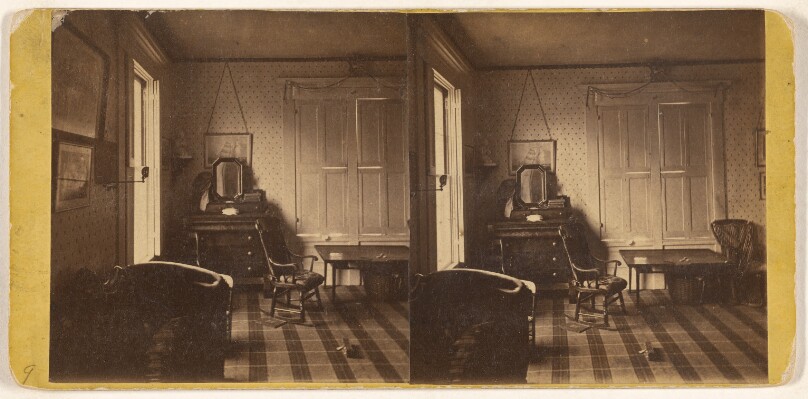[Interior of living room, rocking chair at center]