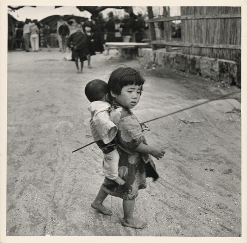 Battle of Okinawa: a child with baby on its back