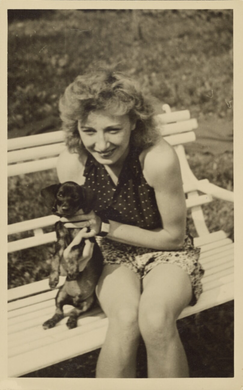 [Woman on bench with dog]