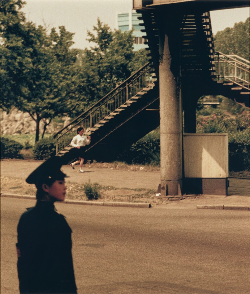 Blow-up #11, Two women under overhead walkway, Pyong Yang, North Korea