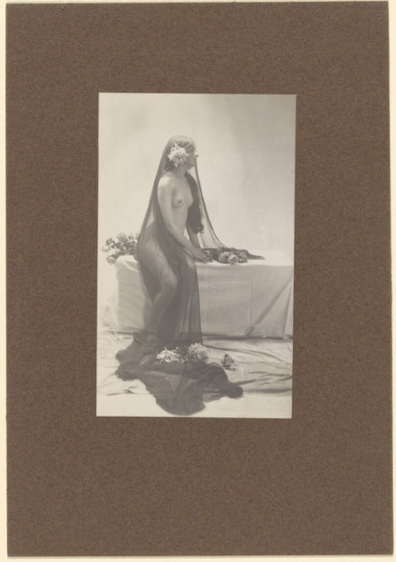 [Draped female nude]
