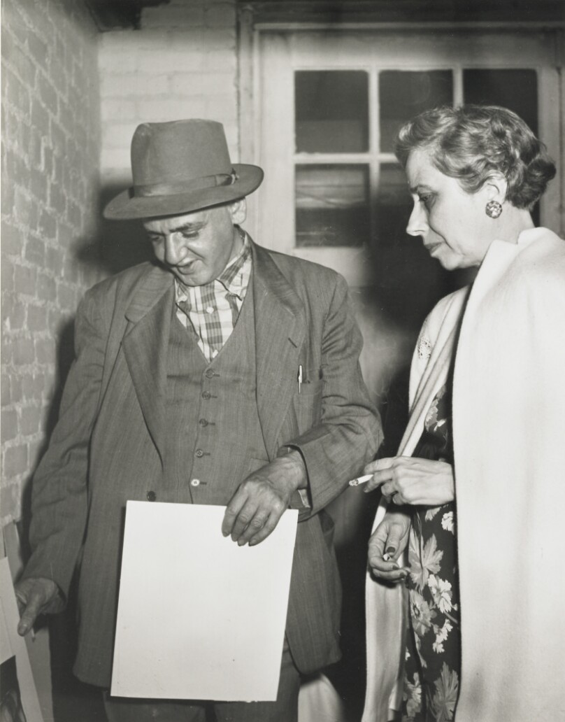 Weegee Critiquing Photos of the Members of the L.A. Photo League