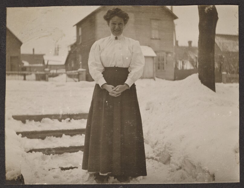 [Woman standing in the snow]