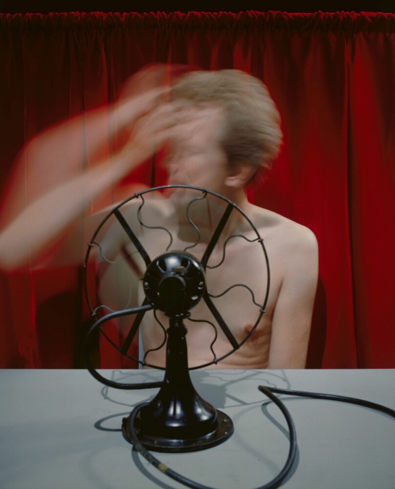 Man and Red Curtain