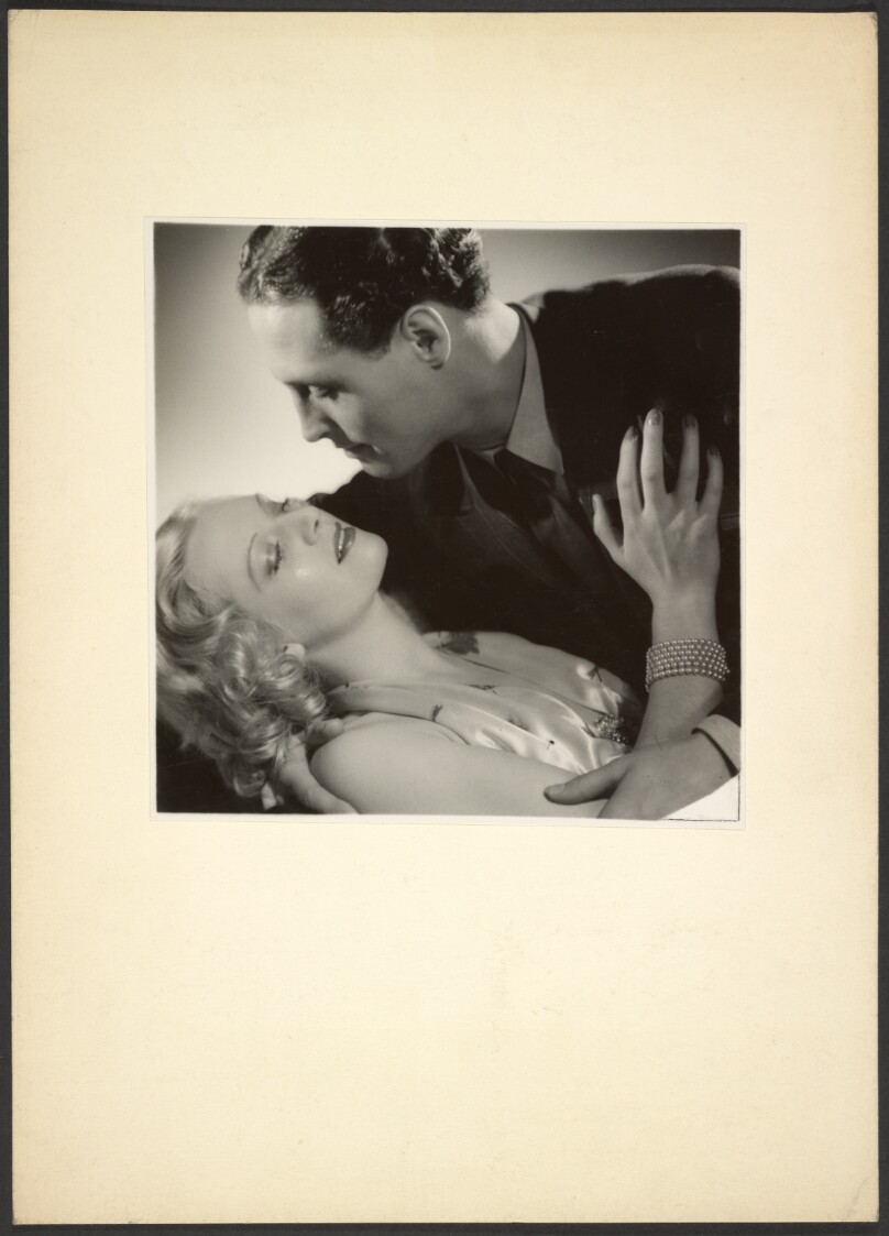 [Man and woman embracing]
