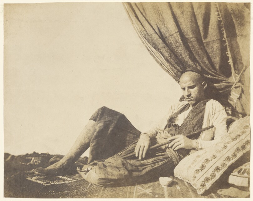 [Reclining Algerian man with pipe]