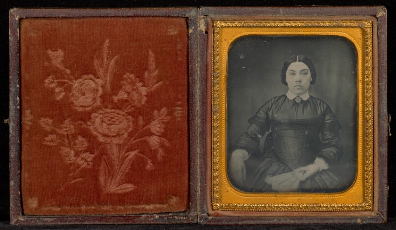 [Portrait of a Woman in a Black Dress Seated and Holding a Fan] 