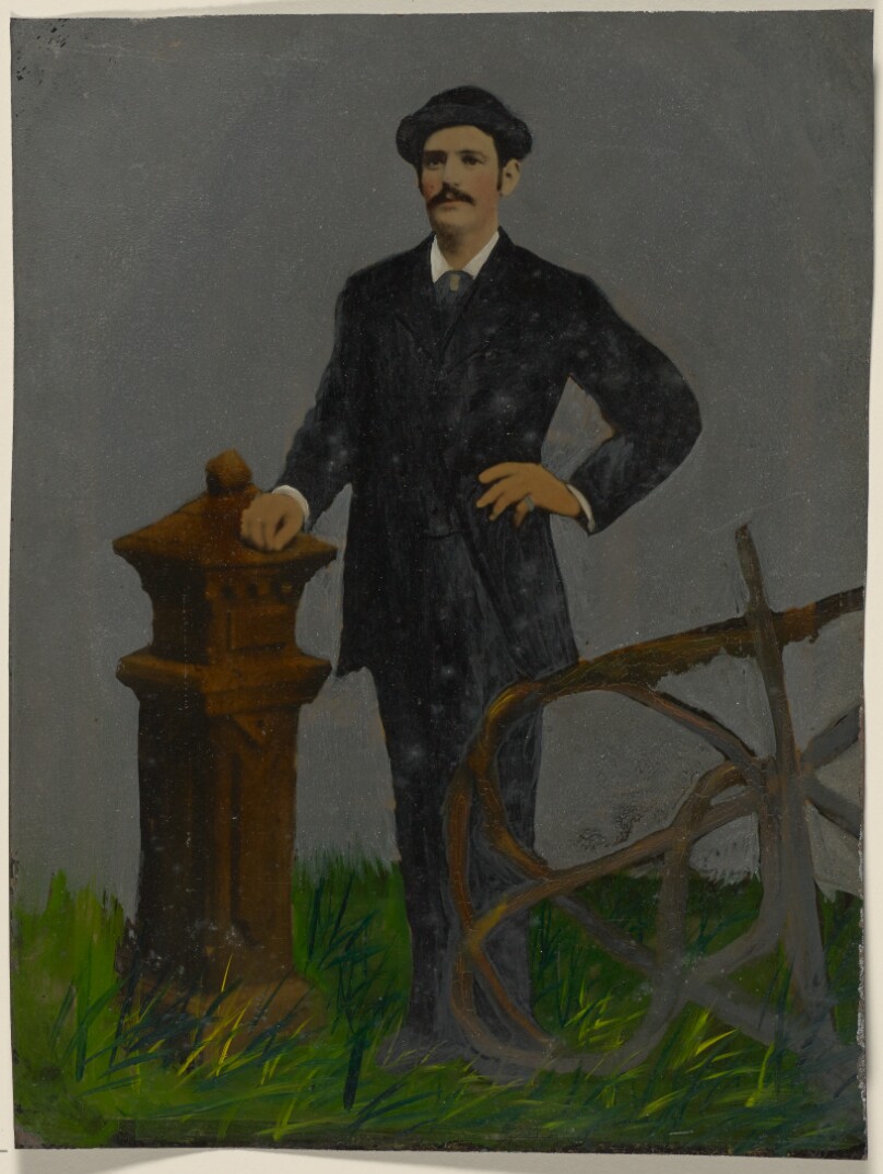 [Portrait of standing man in hat]