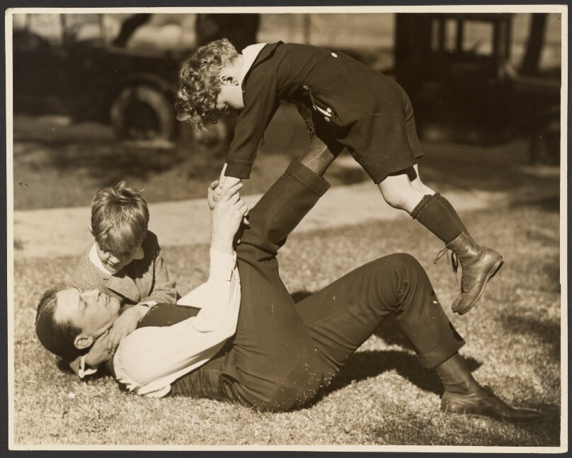 [Man playing with two boys]