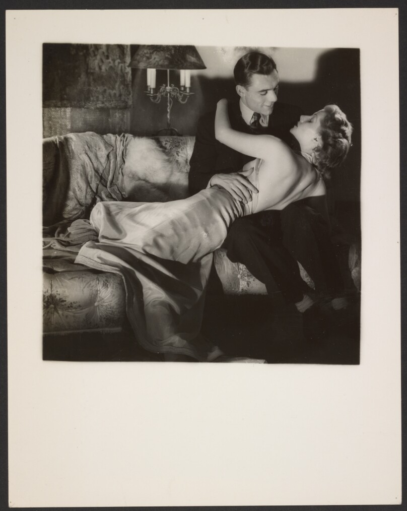 [Man and woman embracing]
