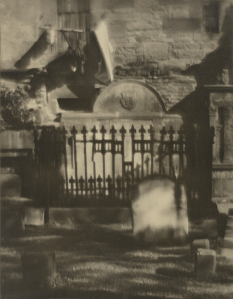 [Linen on Clothespole Flaps Against Funeral Sculpture]
