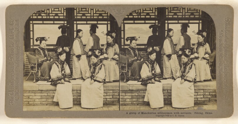 A group of Manchurian noblewomen with servants. Peking, China.