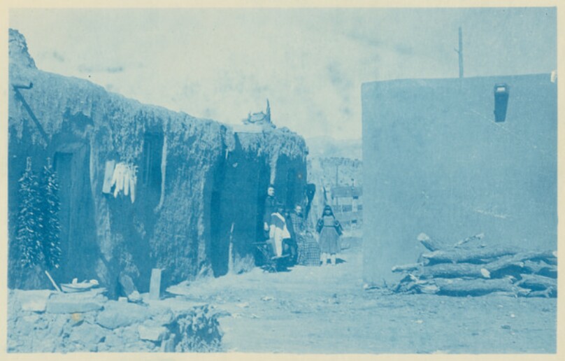 [Isleta, New Mexico: Exterior View of Houses with Eve and Her Sister]