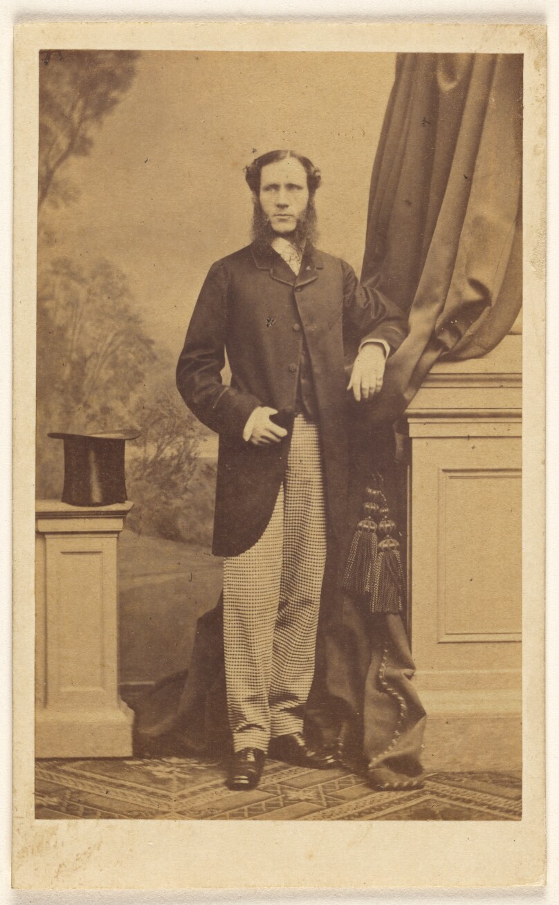 [Unidentified man with long muttonchops, standing]