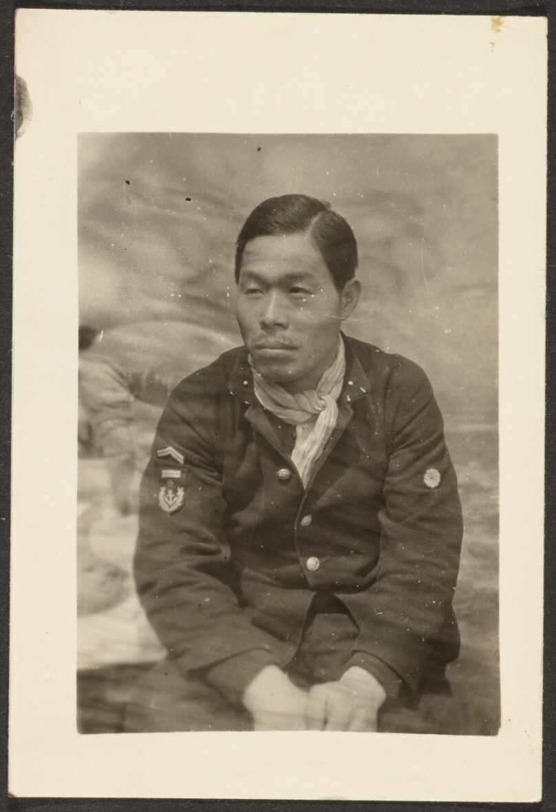 [Asian Man in Uniform]