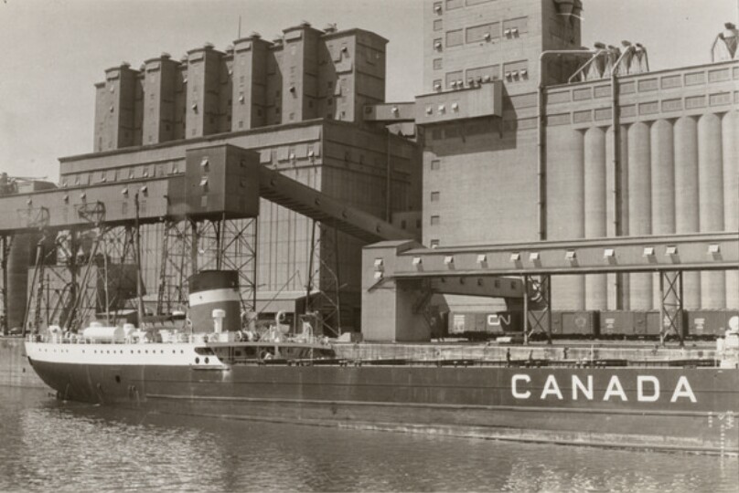 [Freighter "Canada" and grain elevators]