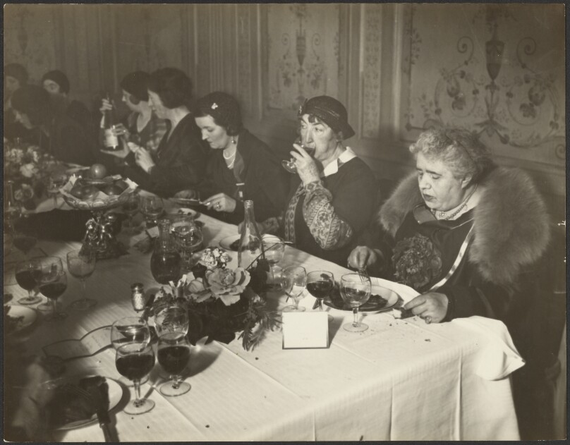 [Eight women dining at a table]