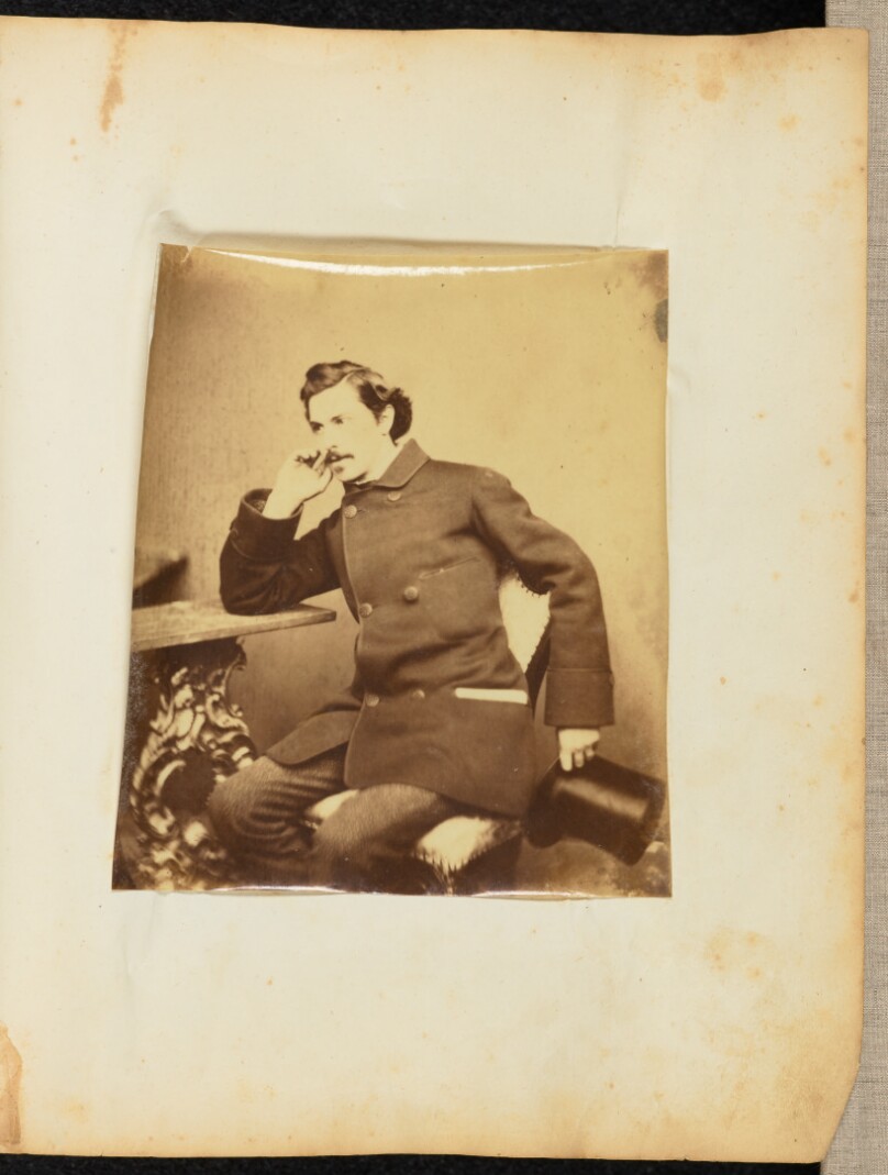 [Portrait of a man at a table]