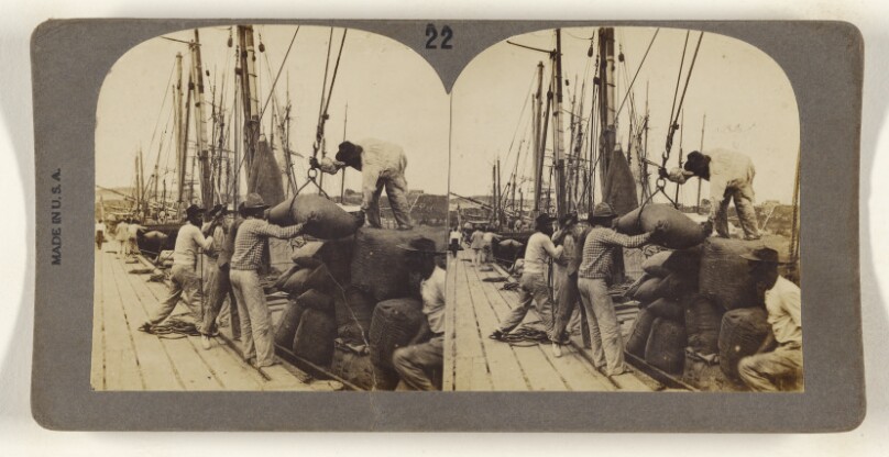 [Men hauling sacks from ship to dock]