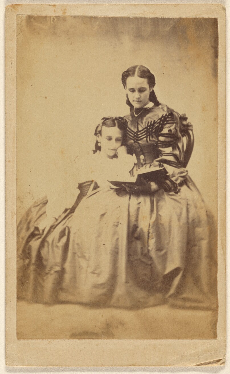 [Unidentified mother reading to her daughter]