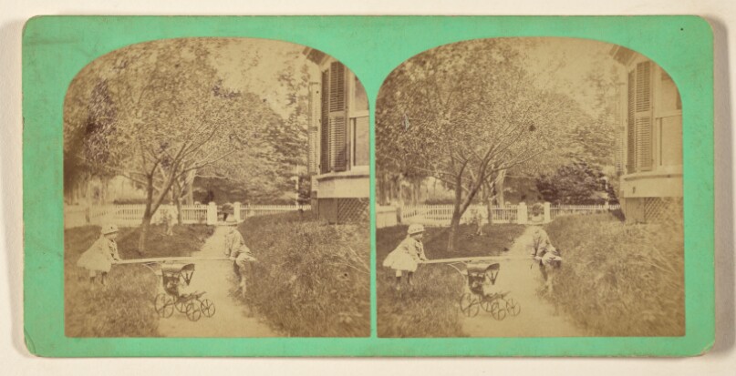 [Two children playing see-saw on baby carriage on front lawn of house, Keene, New Hampshire]