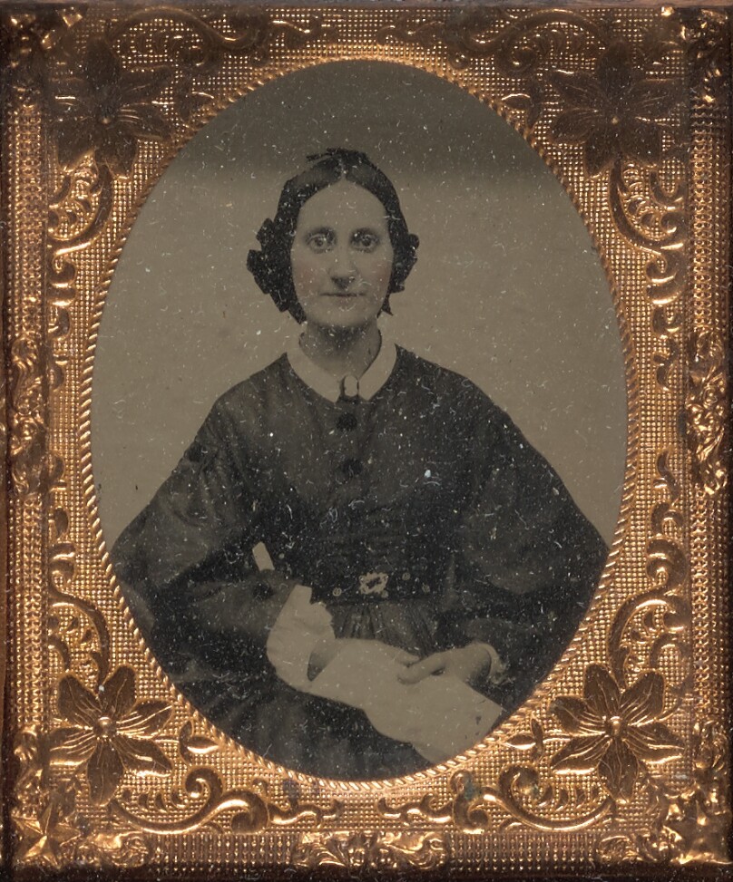 [Young woman seated]