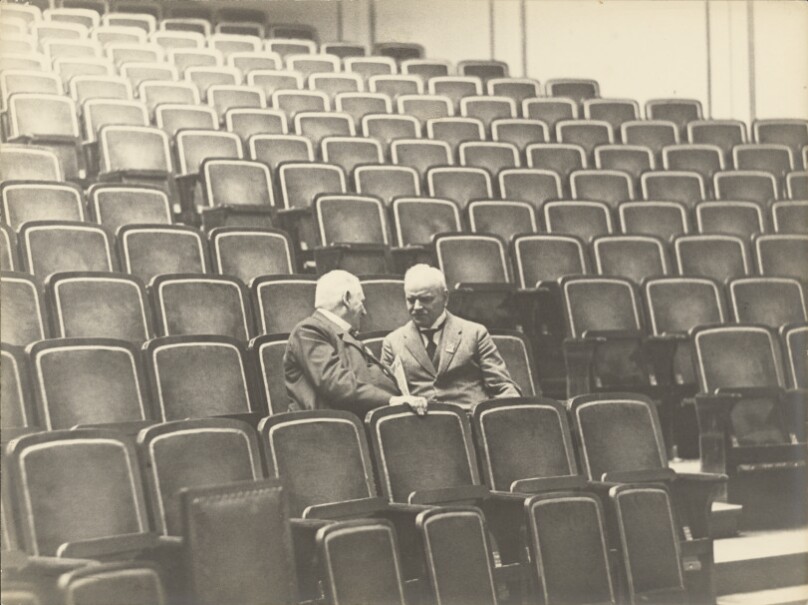 [Two Men in an Auditorium]