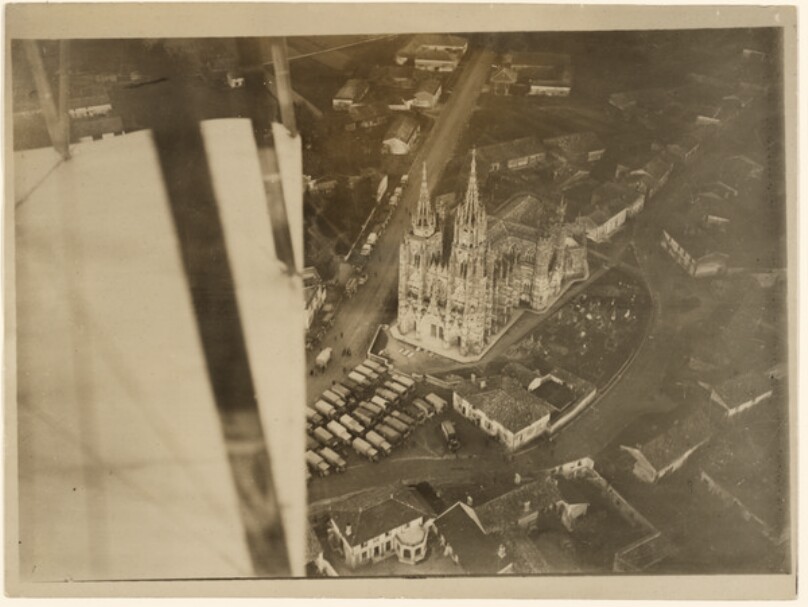 [Aerial View of a French Village with Large Cathedral]